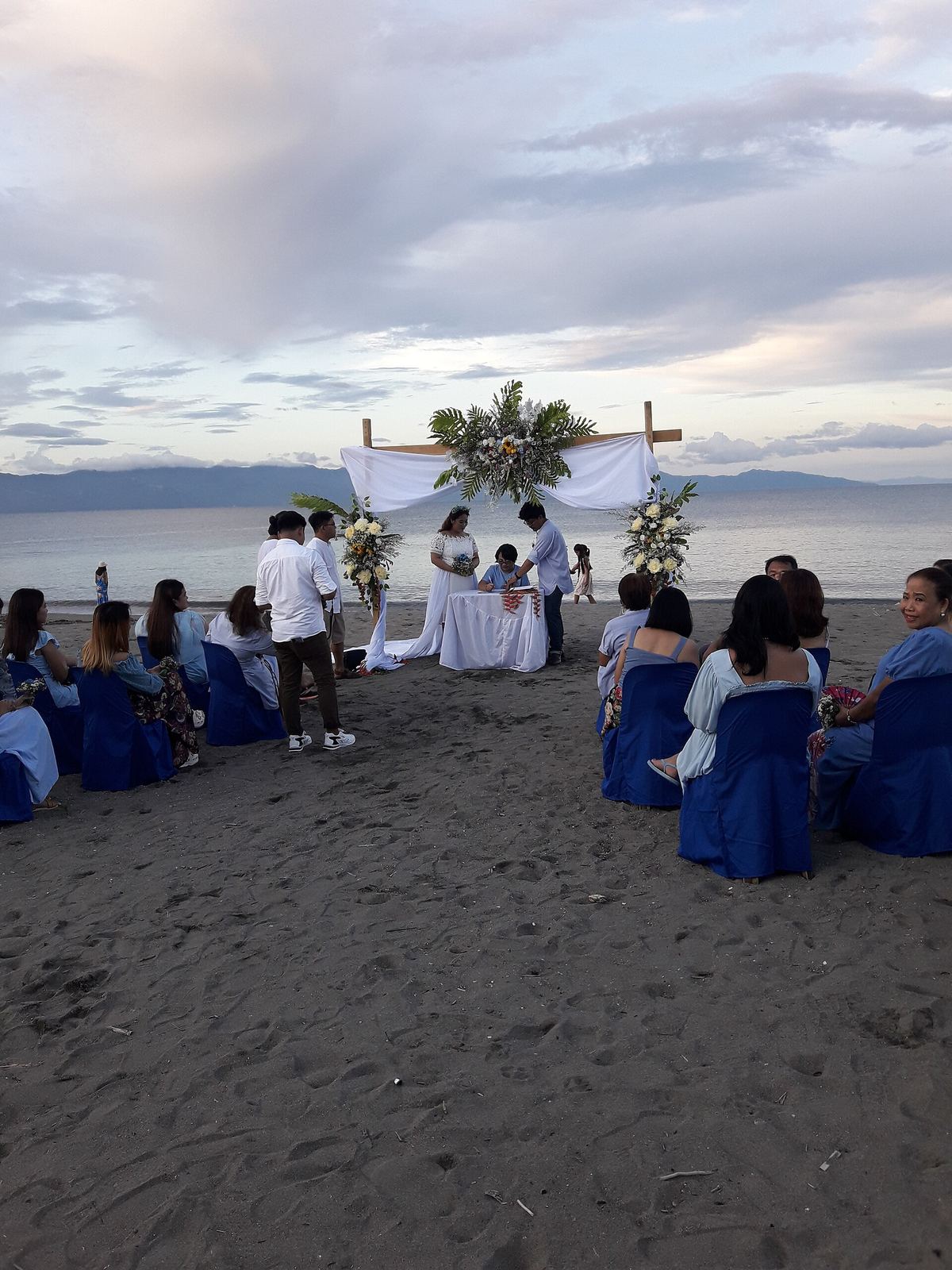 Beach wedding ceremony setup on the sand